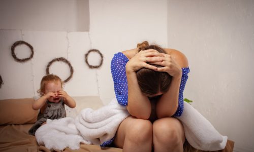 Mom is tired of the baby, wants to rest and sleep. The child screams, hysterical. The woman is tired of the child's cry, she does not want to hear it. A one-year-old girl yells from a toothache.